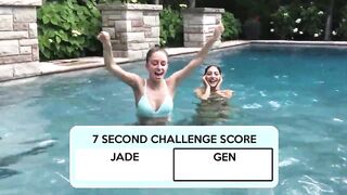 Two Bikini Teens challenging each other in pool