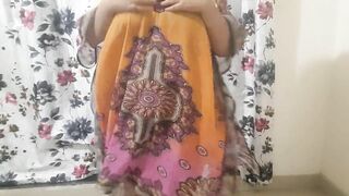 DESI HOT BHABHI GETTING READY FOR BEACH WEARING BIKINI INSIDE HER DRESS ..