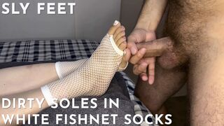 Dirty soles in white fishnet socks get covered with cum