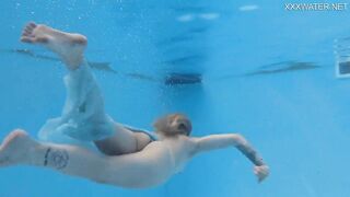 Finnish blonde tattooed pornstar Mimi underwater