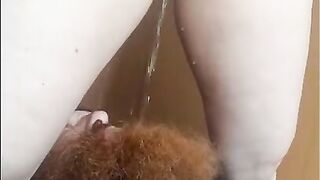 Nerdy Girl pissing in bearded boy mouth