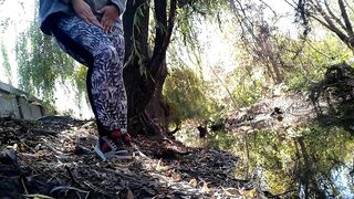 BBW in leggings pissing by lake in public park