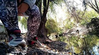 BBW in leggings pissing by lake in public park