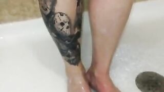 Milf washes feet in the shower