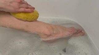 Washing feet in bubble bath