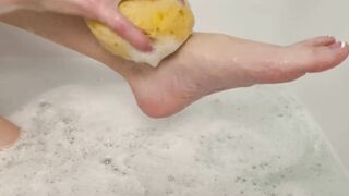 Washing feet in bubble bath