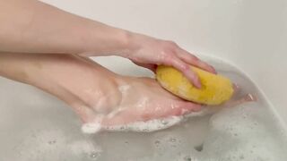 Washing feet in bubble bath