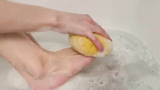 Washing feet in bubble bath