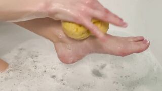 Washing feet in bubble bath