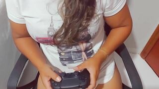 brunette was playing Playstation and ended up winning a stick in her mouth