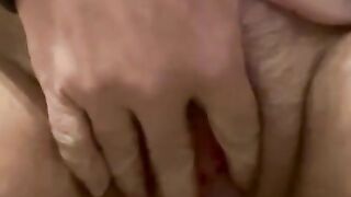 Fingering my hairy pussy while I piss on my hand