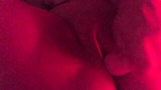 Masturbating in red mood lighting