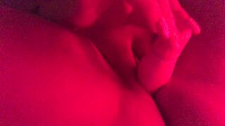 Masturbating in red mood lighting