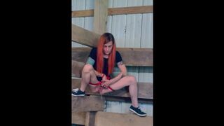 Hot redheaded piss queen, pisses while hanging from a barn stall