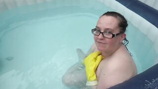 Naked rubber gloves fetish in the hot tub