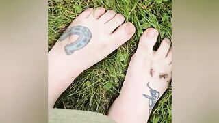 Dirty feet out in the grass