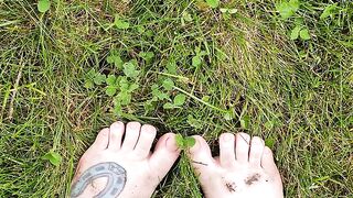 Dirty feet out in the grass